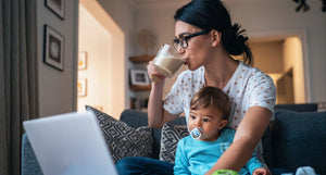 mom with coffee and baby