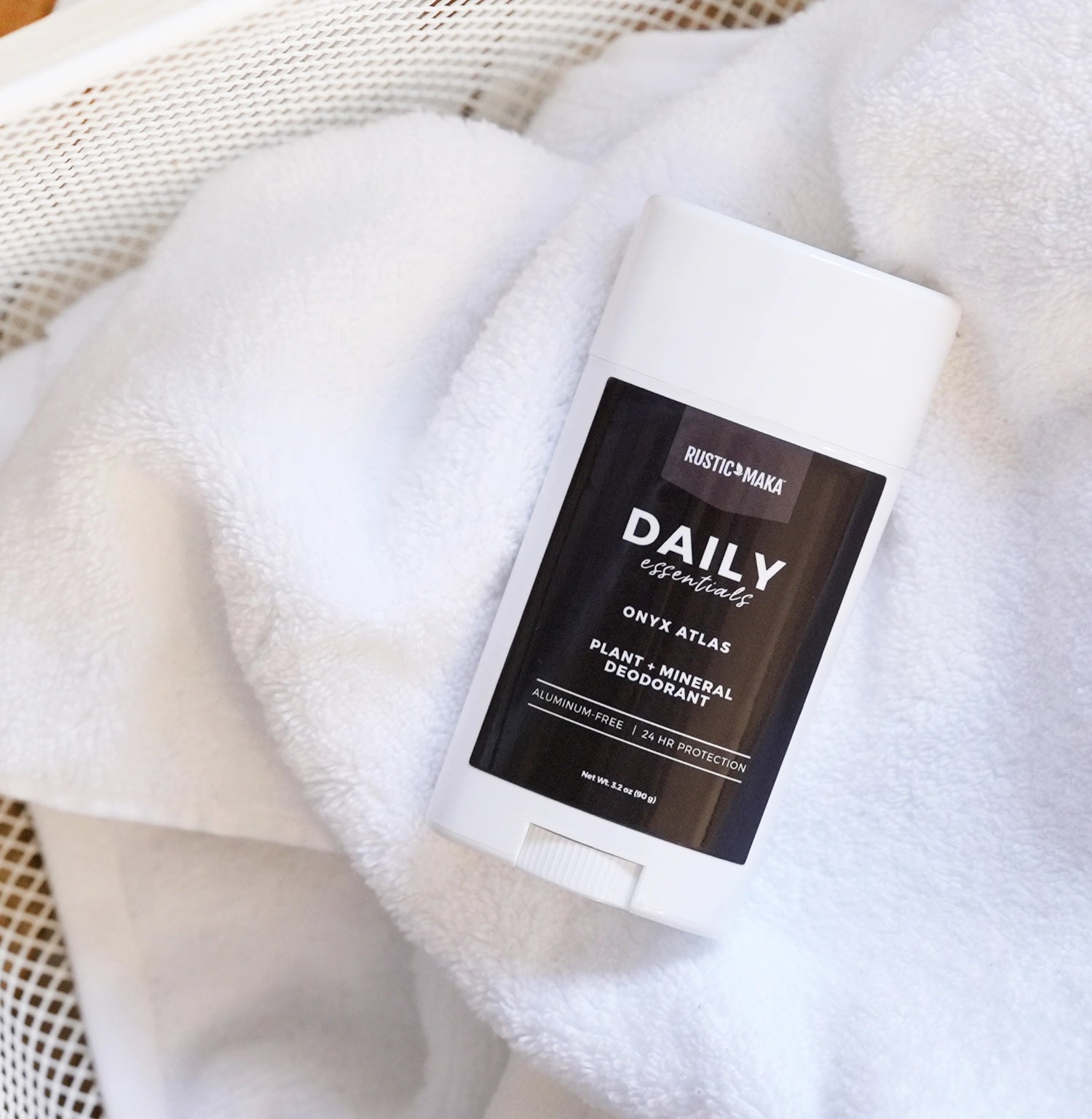 Deodorant stick with label on a white towel